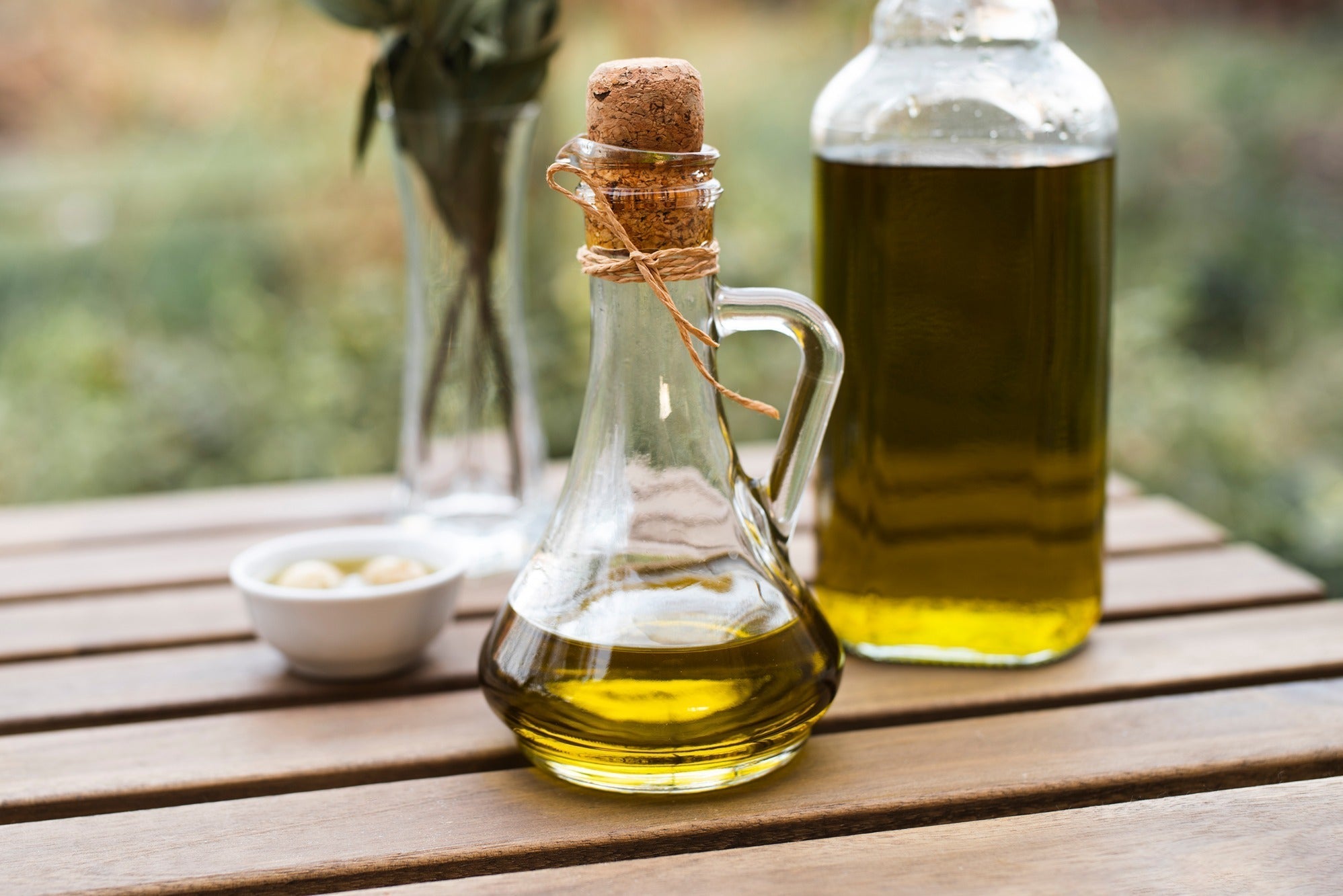 Bottle of plant-based carrier oils including MCT, olive, and sunflower oil 