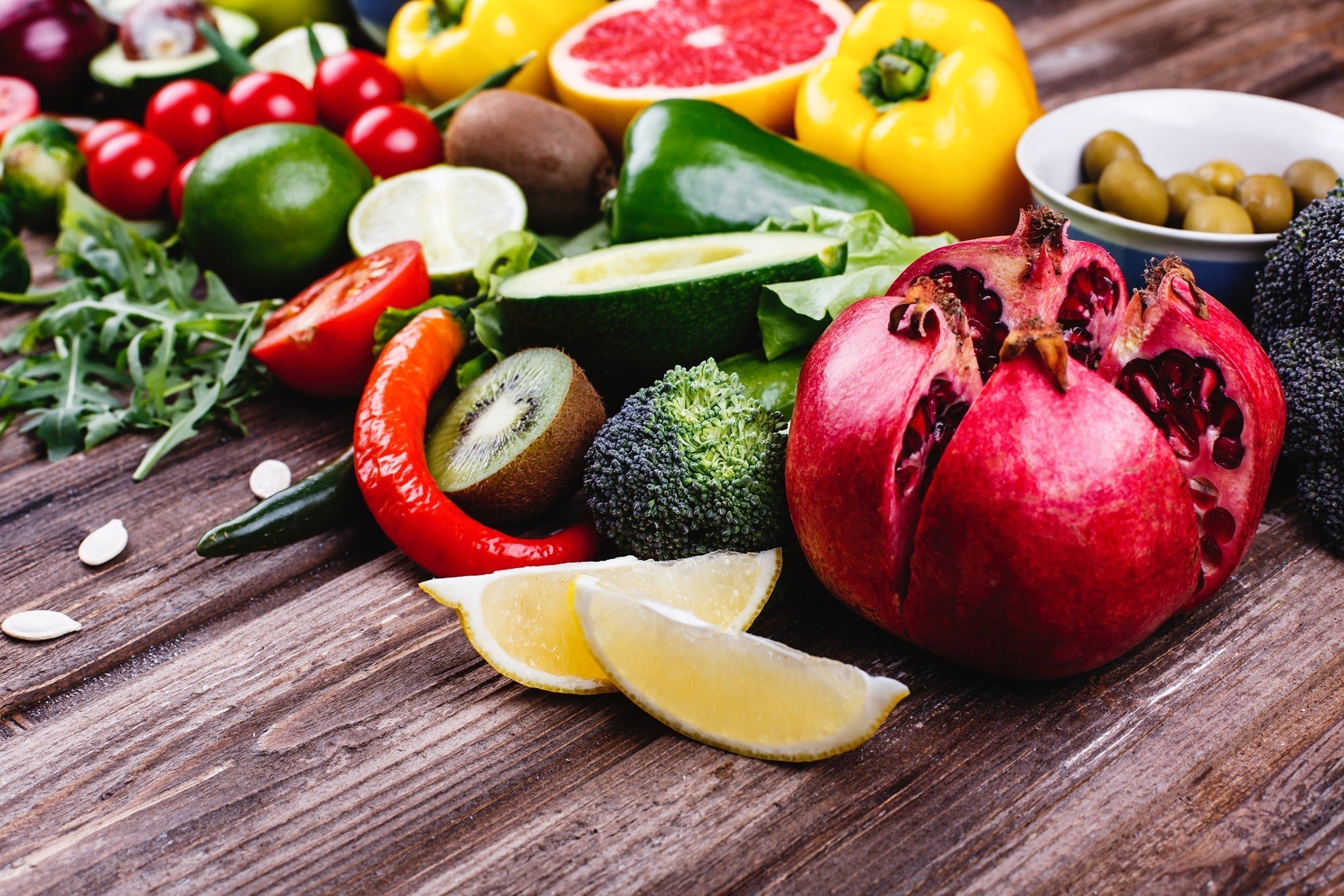 Colorful assortment of fresh fruits and vegetables representing the foundation of healthy aging nutrition.